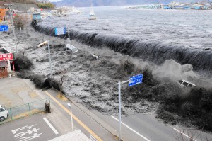 A wave approaches Miyako City from the Heigawa estuary in Iwate Prefecture